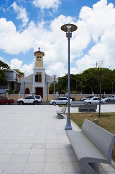 Cars moving on the road in front of a church, Luquillo, Puerto Rico