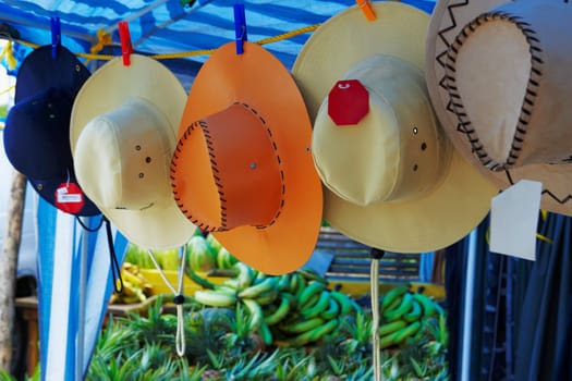 Sun hats hanging at a market stall, Puerto Rico