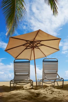 Two outdoor chairs and a beach umbrella on the beach, Ocean Park, El Condado, San Juan, Puerto Rico