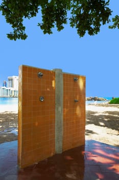 Outdoor showers on an empty beach, Condado Beach, San Juan, Puerto Rico