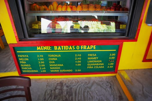 Display cabinet and a menu at a juice bar