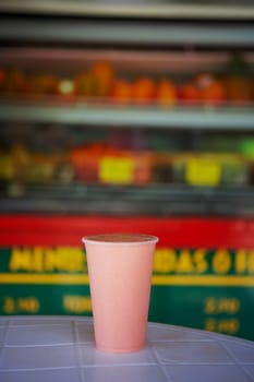 Close-up of a glass of juice on a table at a juice bar