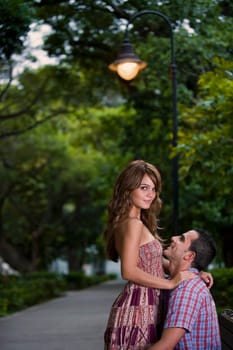 Side profile of a young couple romancing