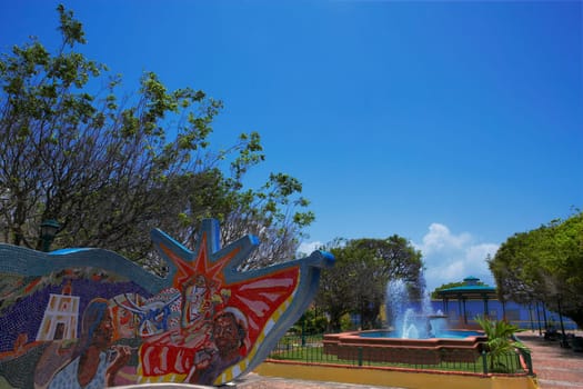 Fountain and a sculpture in a plaza, Loiza, Puerto Rico