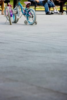 Two bicycles parked on a road