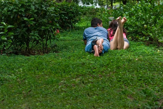 Young couple lying in a park