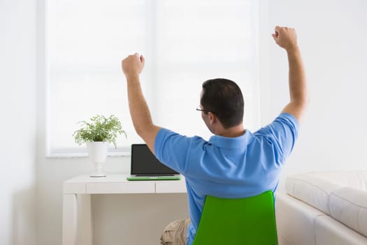 Man stretching in a chair