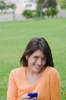 Teenage girl holding a mobile phone