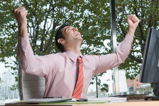 Businessman looking excited in an office