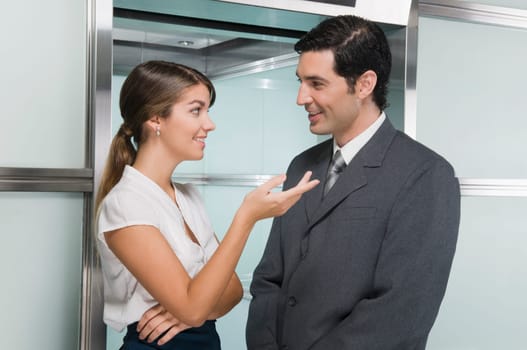 business executives discussing in a corridor