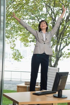 Businesswoman looking excited in an office
