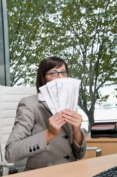 Portrait of a businesswoman holding bills