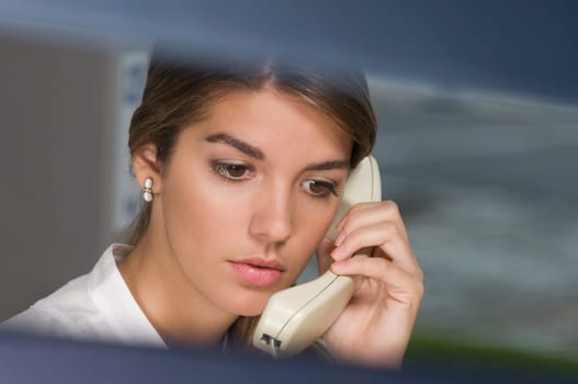 Businesswoman talking on the telephone in an office