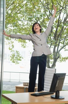 Businesswoman looking excited in an office
