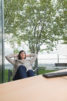 Businesswoman relaxing in an office