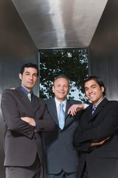 Portrait of three businessmen smiling