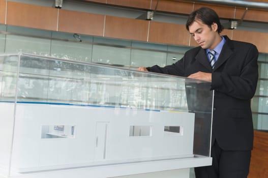 Businessman looking at an architectural model
