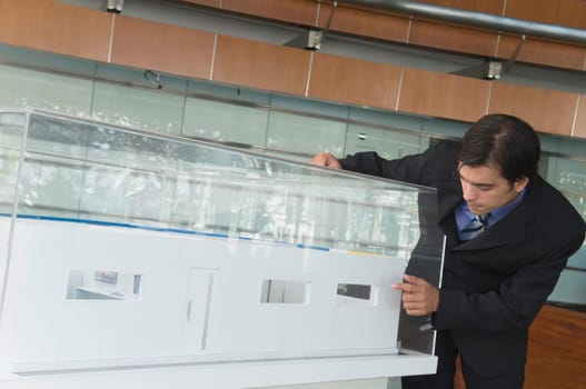 Businessman looking at an architectural model