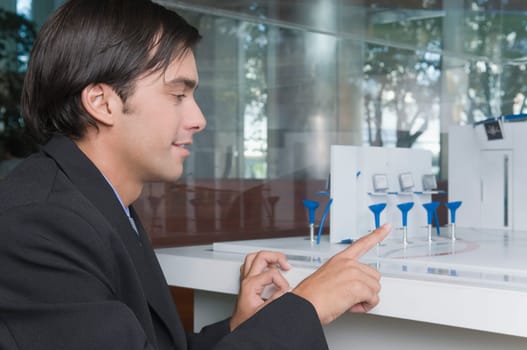 Businessman looking at an architectural model