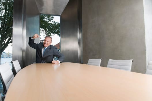 Businessman looking upset in a board room
