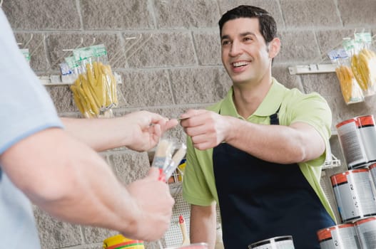 Man paying with a credit card in a hardware store