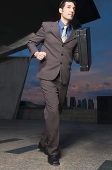 Businessman running with a briefcase