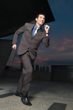 Businessman running with a briefcase