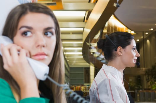 Female customer service representatives working in an office