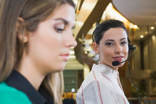 Female customer service representatives working in an office