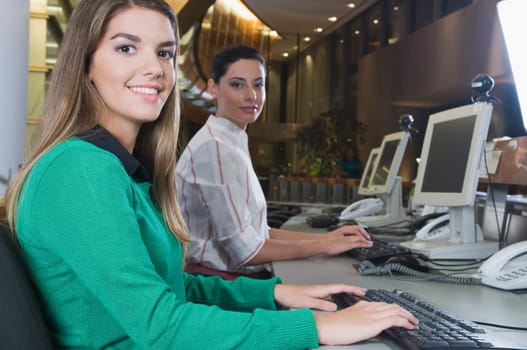 Female customer service representatives working in an office