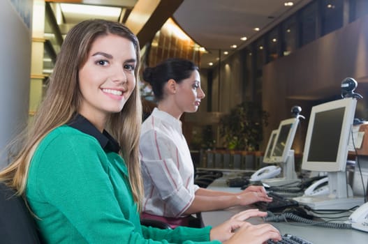 Female customer service representatives working in an office