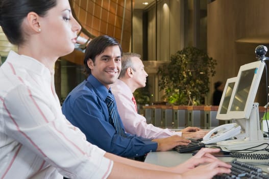Customer service representatives working in an office