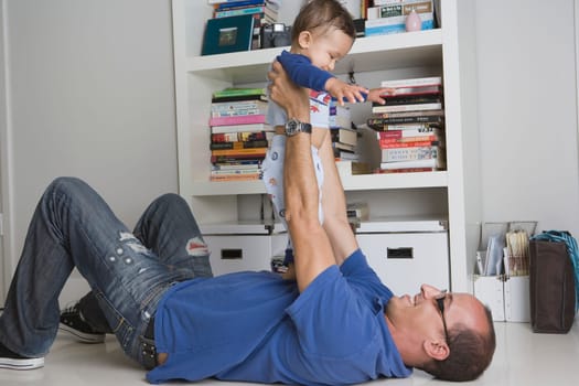 Man playing with baby boy