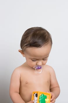 Baby boy playing with a toy
