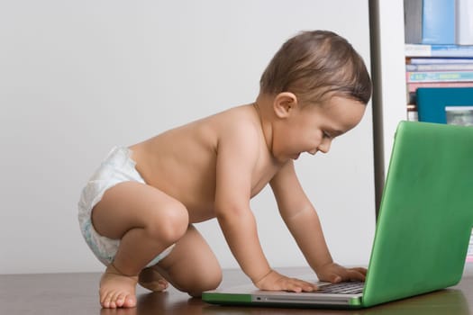 Baby boy using a laptop