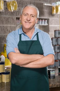 Portrait of a sales clerk smiling in a hardware store
