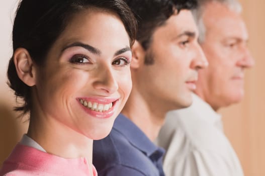 Woman smiling with her family beside him