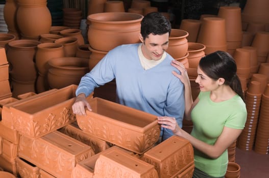 Couple choosing a flower pot