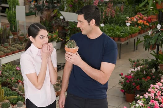 Couple choosing plants in a garden center