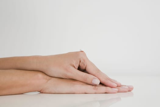 Close-up of a pill on a person's knuckle
