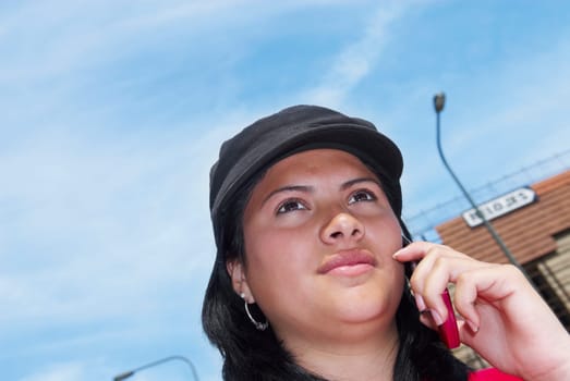 Low angle view of a young woman talking on a mobile phone