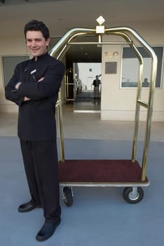 Doorman standing with his arms crossed