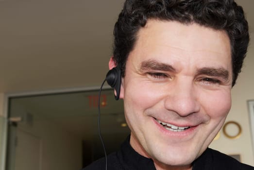Close-up of a doorman wearing a hands free device