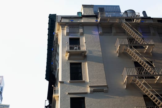 Low angle view of a building with fire escapes