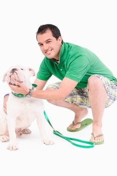 Portrait of a young man pampering his dog