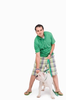 Portrait of a young man standing with a dog