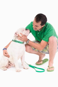 Young man pampering a dog