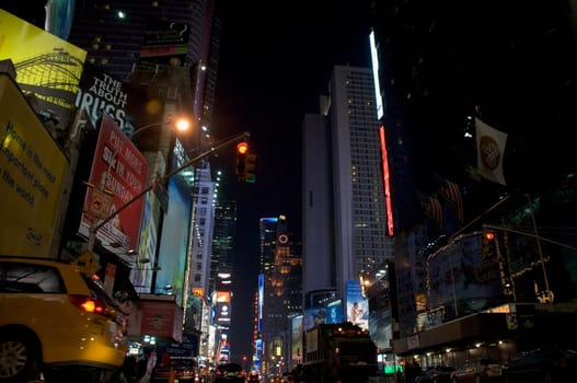 Buildings lit up at night in a city