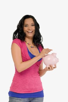 Portrait of a young woman holding a piggy bank and smiling