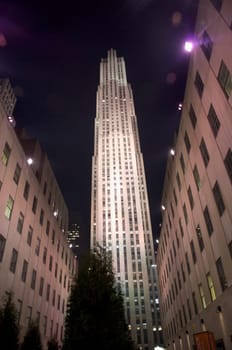 Low angle view of buildings lit up at night